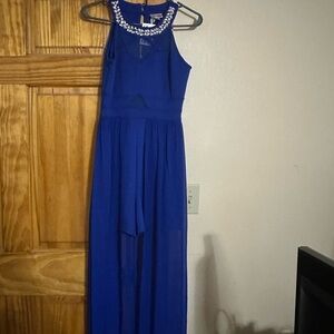 Elegant Blue Sleeveless Jumpsuit with Embellished Neckline